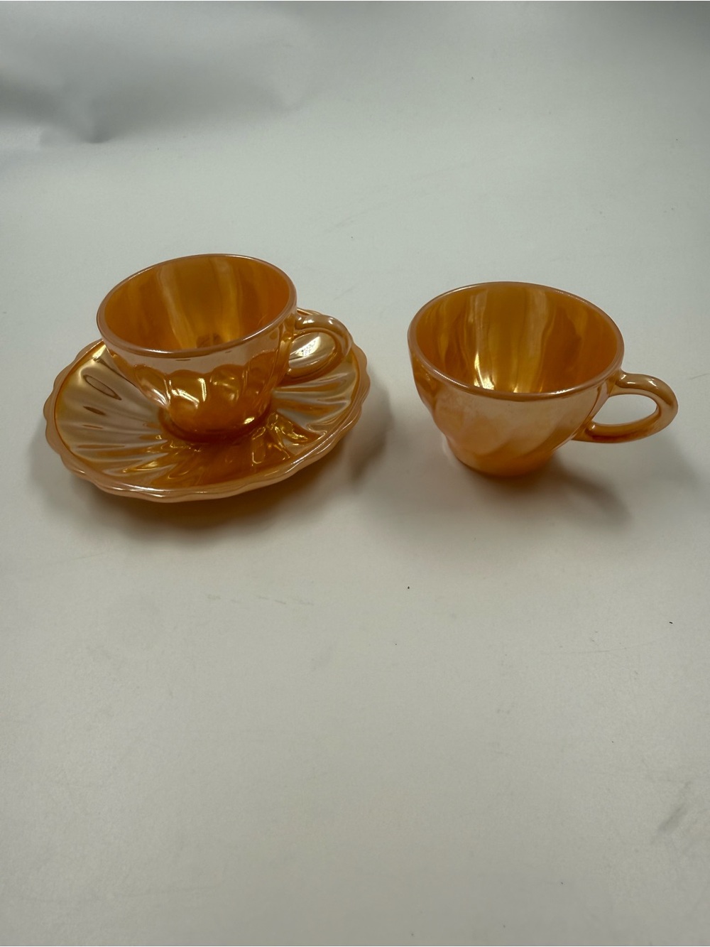Vintage fire king peach lustreware cup x 2 & saucer